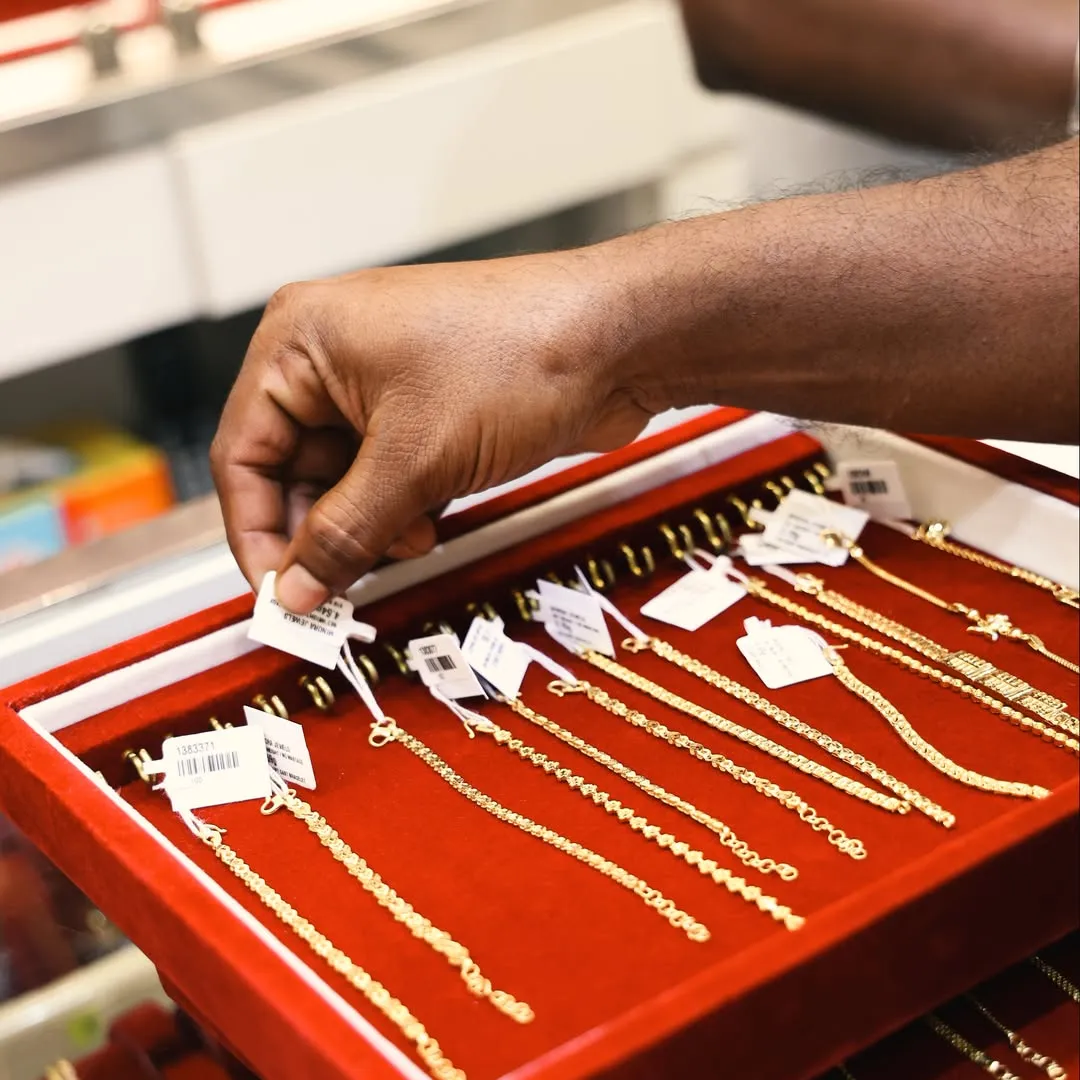 A tray of gold chains on the counter at the Minora Jewels showroom